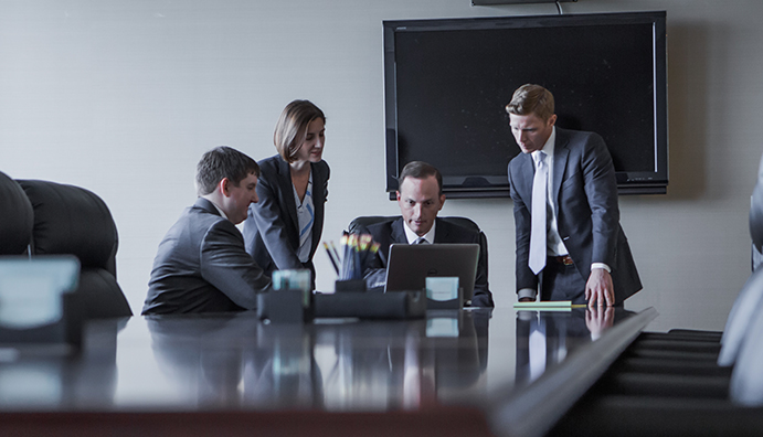 The Dowd Bennett lawyers collaborating during a photo shoot for the new website design.