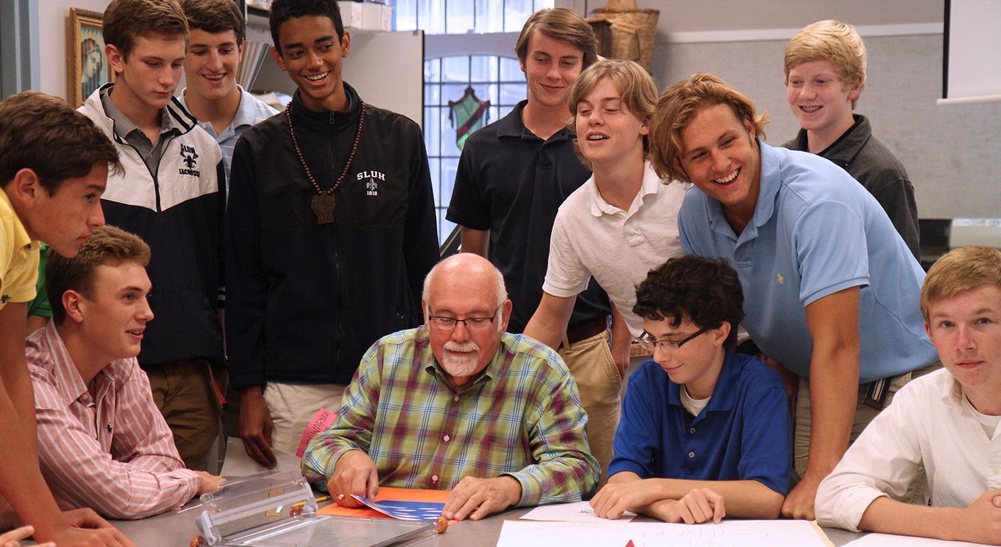 Students at SLUH adorned in multiple iterations of the outdated school logo.