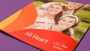 The cover of the Cor Jesu Academy viewbook proudly shows the new All Heart branding.
