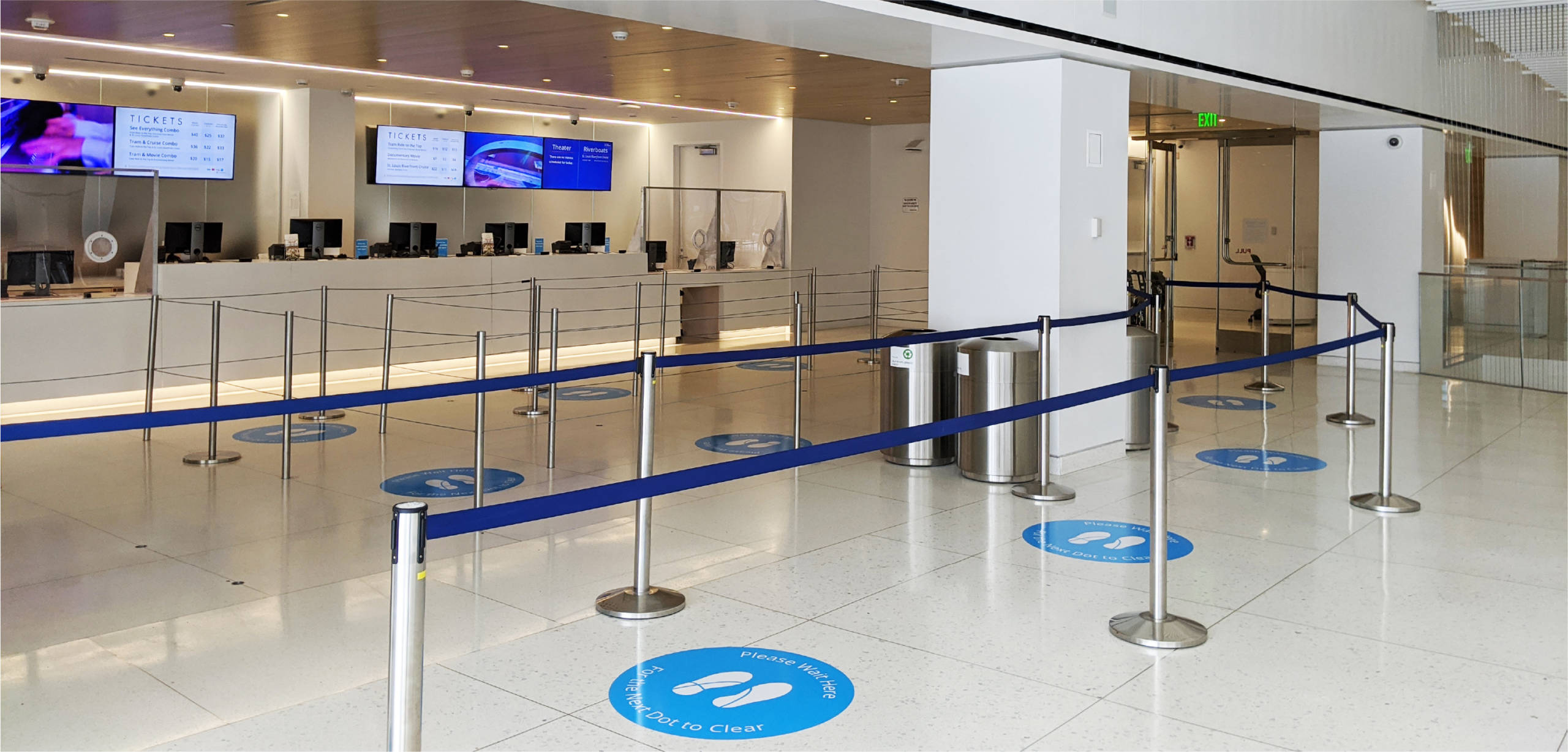 Floor markers to help with wayfinding in the Ticketing Center at the Gateway Arch.