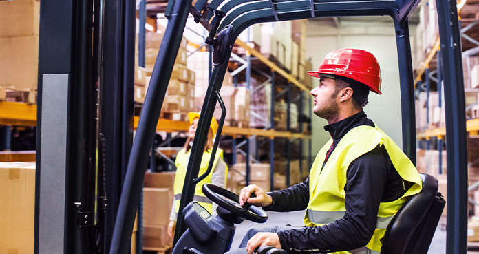 man on forklift in warehouse