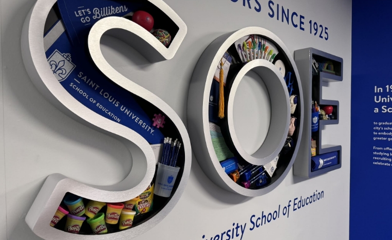 3D rendering of the letters SOE with school supplies inside the letters.