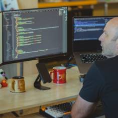 web developer looking at code on his computer